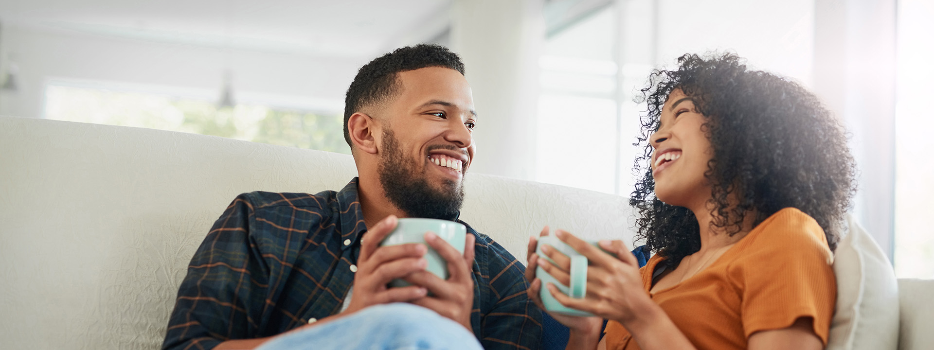 A group of people at a table smiling and talking