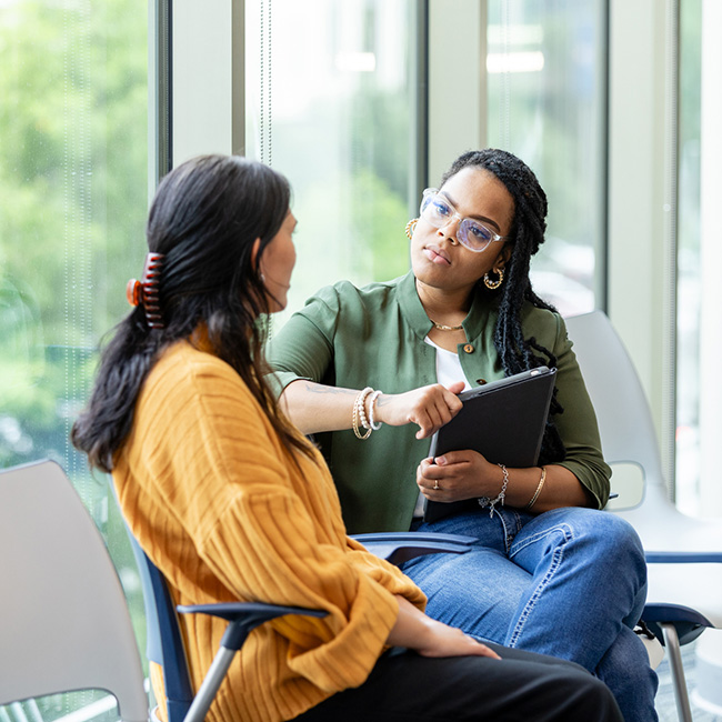 Woman speaking with therapist