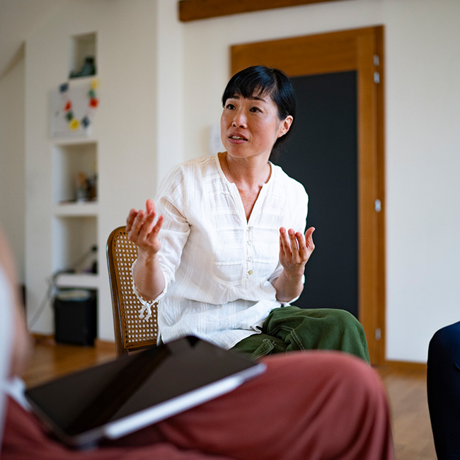 Woman leading a support group meeting