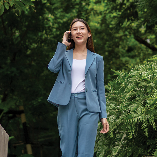 A businesswoman walking outside
