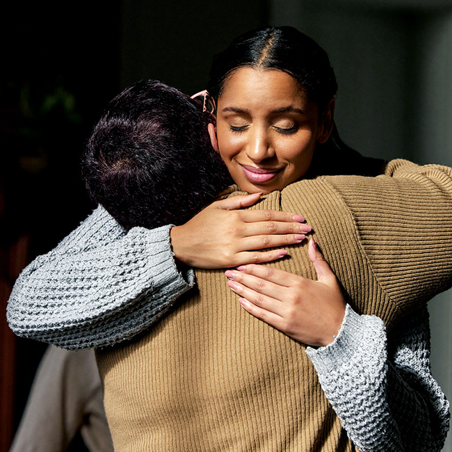 A woman hugging someone