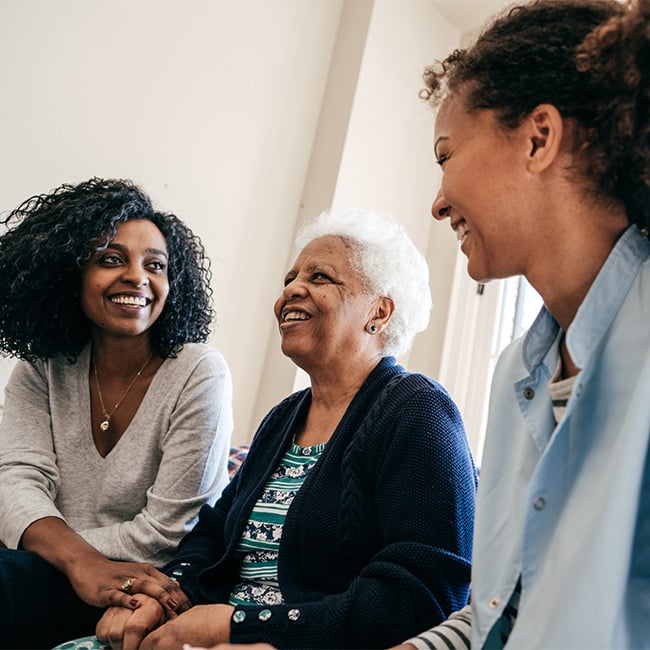 Two women spending time with an older woman